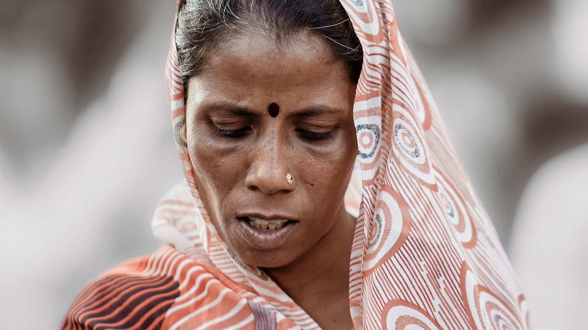 Portrait of an Indian woman wearing a patterned headscarf with a bindi, Mumbai, India